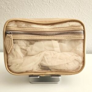 Trish McEvoy - Tan Mesh Cosmetic Bag. NEVER USED.
